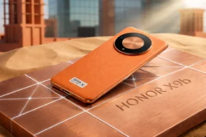 Honor X9b. By showing the distinctive Sunrise Orange vegan leather back and the large, circular camera module, it validates the rugged, active lifestyle aesthetic you describe in the text